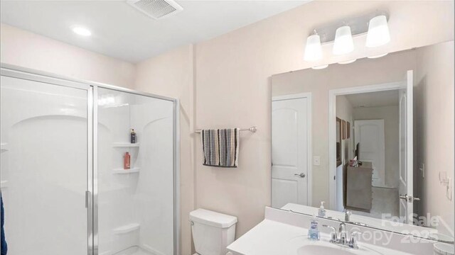 2009 Trindle Vine Ln, Waxhaw, NC 28173 - bathroom with toilet, a stall shower, and vanity