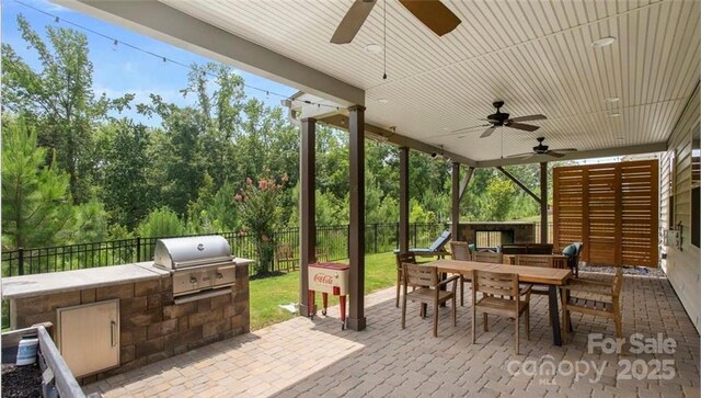 2009 Trindle Vine Ln, Waxhaw, NC 28173 - view of patio featuring ceiling fan and outdoor dining space