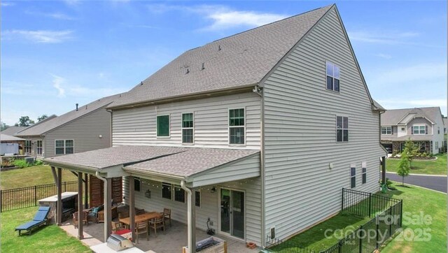 2009 Trindle Vine Ln, Waxhaw, NC 28173 - back of house with a patio area and roof with shingles