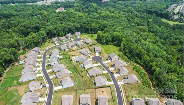 2009 Trindle Vine Ln, Waxhaw, NC 28173 - view of property location featuring a forest and nearby suburban area