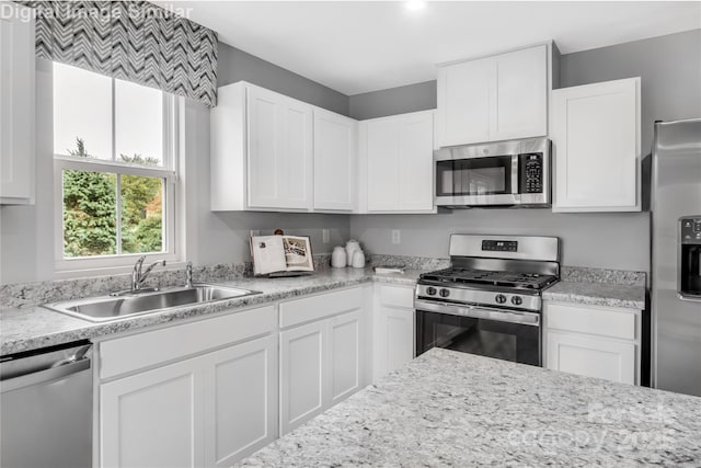 5995 Granbury Dr, Kannapolis, NC 28081 - kitchen with stainless steel appliances, a sink, and white cabinets
