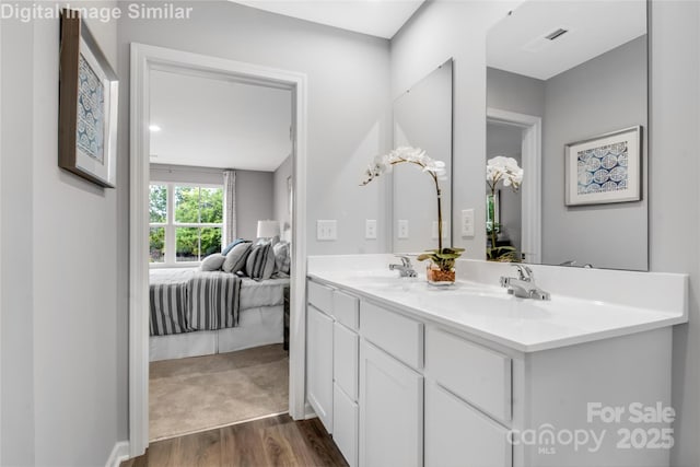 5995 Granbury Dr, Kannapolis, NC 28081 - full bathroom featuring ensuite bath, double vanity, and wood finished floors