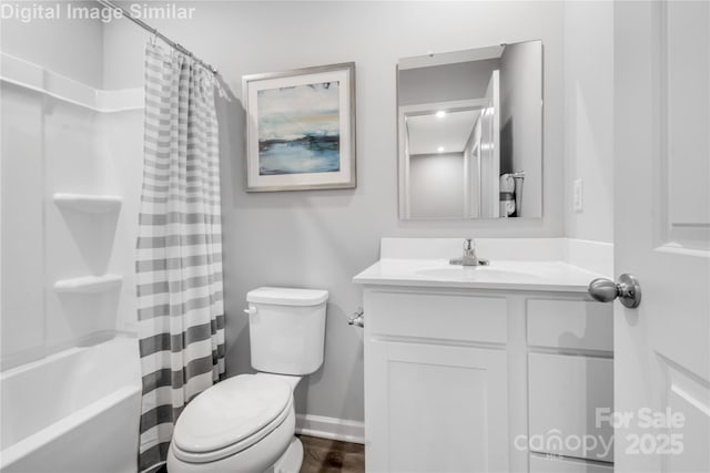5995 Granbury Dr, Kannapolis, NC 28081 - full bathroom with vanity, toilet, shower / bath combo with shower curtain, and baseboards