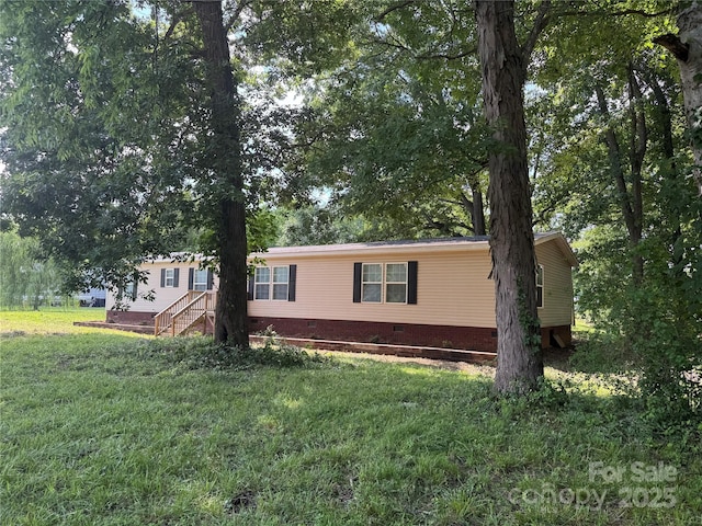 1555 Moore Rd, York, SC 29745 - view of property exterior featuring crawl space and a yard