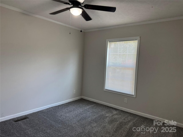 1555 Moore Rd, York, SC 29745 - empty room with ceiling fan, dark carpet, baseboards, and crown molding