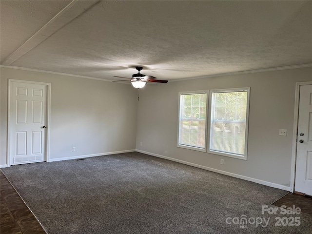 1555 Moore Rd, York, SC 29745 - empty room featuring ceiling fan, crown molding, baseboards, dark colored carpet, and a textured ceiling