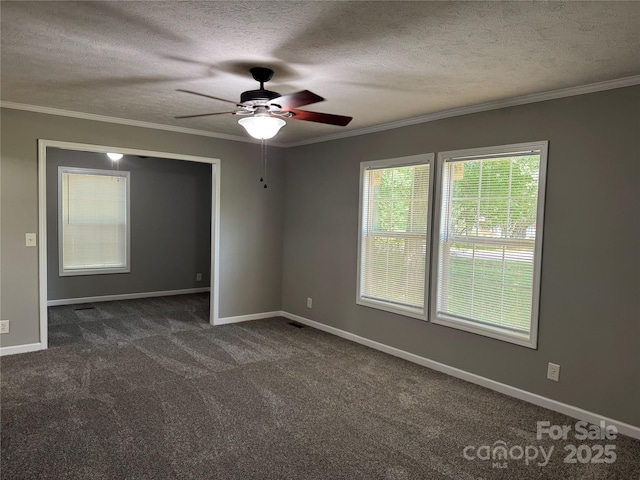 1555 Moore Rd, York, SC 29745 - spare room featuring dark colored carpet, a ceiling fan, crown molding, a textured ceiling, and baseboards