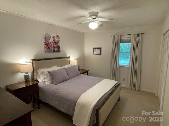 103 Boyd Dr, Stanley, NC 28164 - bedroom with light colored carpet, a ceiling fan, a textured ceiling, and baseboards
