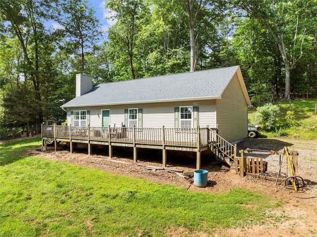 55 Gilbert B Crook Rd, Candler, NC 28715 - rear view of house with a wooden deck, a chimney, a lawn, and a shingled roof
