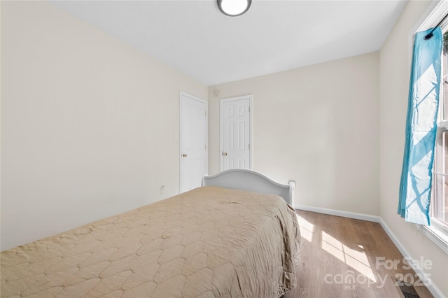 55 Gilbert B Crook Rd, Candler, NC 28715 - bedroom with wood finished floors and baseboards