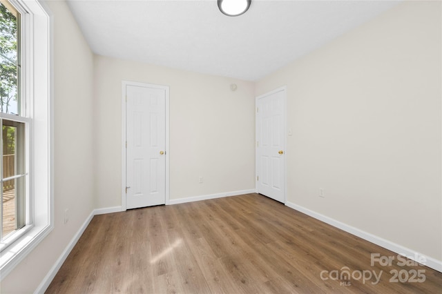 55 Gilbert B Crook Rd, Candler, NC 28715 - unfurnished bedroom with wood finished floors and baseboards