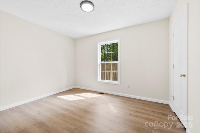 55 Gilbert B Crook Rd, Candler, NC 28715 - spare room featuring wood finished floors and baseboards