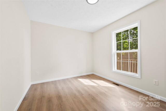 55 Gilbert B Crook Rd, Candler, NC 28715 - spare room with wood finished floors and baseboards