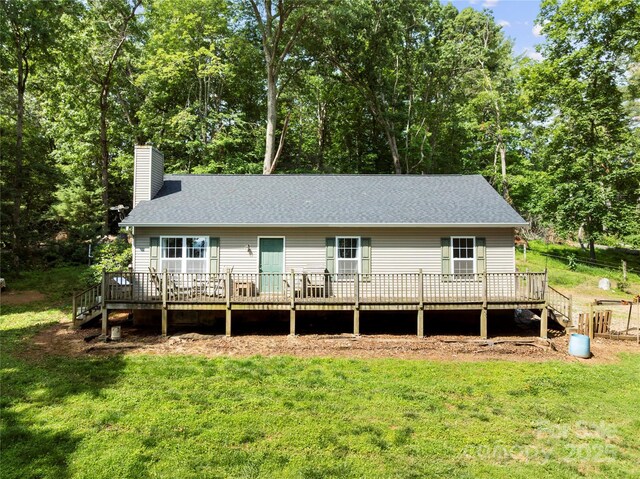 55 Gilbert B Crook Rd, Candler, NC 28715 - back of house with a chimney, a deck, and a yard