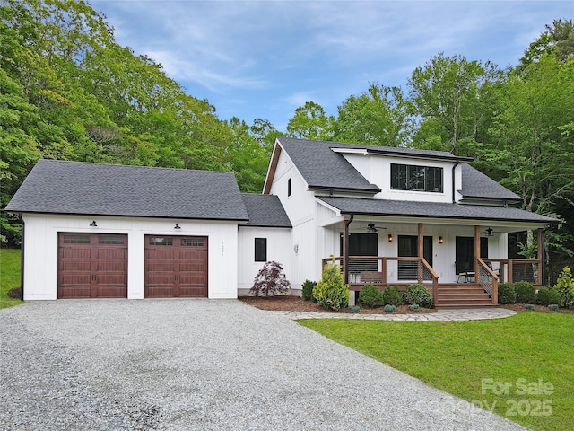 1291 George Hayes Rd, Boone, NC 28607 - modern inspired farmhouse featuring gravel driveway, an attached garage, a porch, and a front lawn