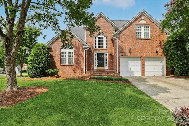 2321 Oberwood Dr, Charlotte, NC 28270 - traditional-style home with driveway, a front yard, brick siding, and a garage