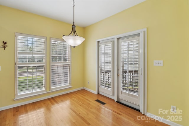 2321 Oberwood Dr, Charlotte, NC 28270 - unfurnished dining area with baseboards and wood finished floors