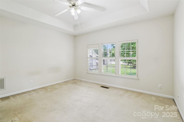 2321 Oberwood Dr, Charlotte, NC 28270 - carpeted spare room featuring a tray ceiling and a ceiling fan