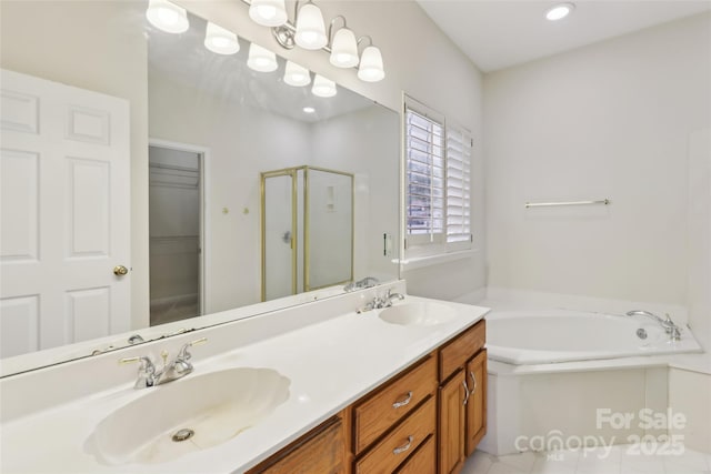 2321 Oberwood Dr, Charlotte, NC 28270 - bathroom featuring a stall shower, a bath, double vanity, a walk in closet, and tile patterned floors