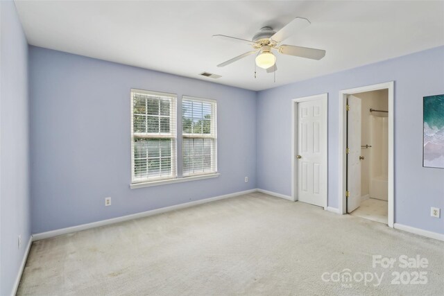 2321 Oberwood Dr, Charlotte, NC 28270 - unfurnished bedroom featuring carpet flooring, ceiling fan, and ensuite bathroom