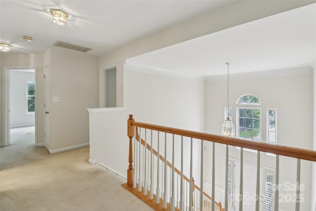 2321 Oberwood Dr, Charlotte, NC 28270 - hallway with an upstairs landing, carpet flooring, and crown molding