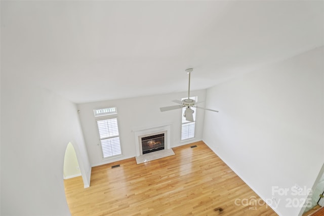 2321 Oberwood Dr, Charlotte, NC 28270 - unfurnished living room with a high end fireplace, light wood-style floors, and ceiling fan