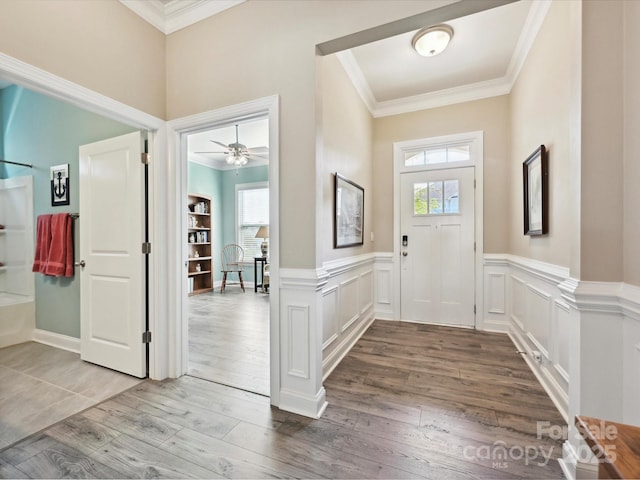 177 Yellow Birch Loop, Mooresville, NC 28117 - foyer featuring crown molding, wood finished floors, and a wainscoted wall