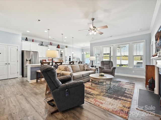 177 Yellow Birch Loop, Mooresville, NC 28117 - living area featuring a ceiling fan, wood-type flooring, ornamental molding, recessed lighting, and baseboards