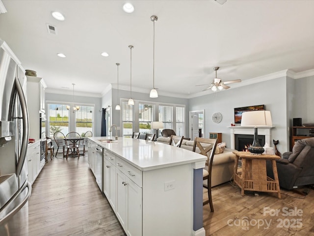 177 Yellow Birch Loop, Mooresville, NC 28117 - kitchen with a kitchen bar, a sink, white cabinetry, an island with sink, and recessed lighting