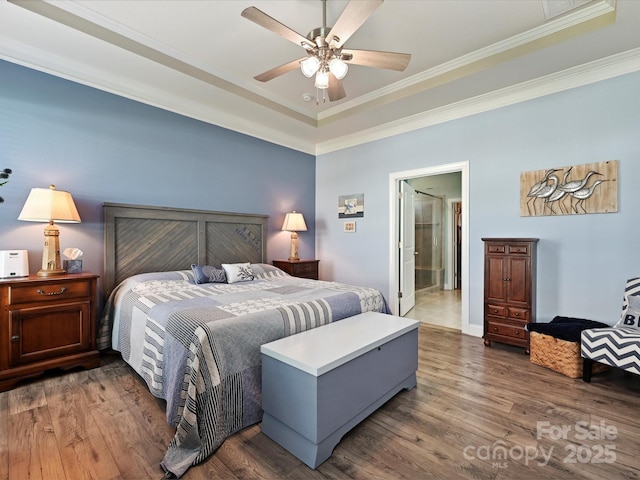 177 Yellow Birch Loop, Mooresville, NC 28117 - bedroom with wood finished floors, ornamental molding, a ceiling fan, and a raised ceiling