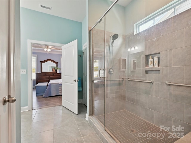 177 Yellow Birch Loop, Mooresville, NC 28117 - ensuite bathroom with tile patterned flooring, a stall shower, healthy amount of natural light, and baseboards