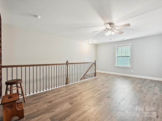 177 Yellow Birch Loop, Mooresville, NC 28117 - empty room with ceiling fan, wood finished floors, a smoke detector, and baseboards