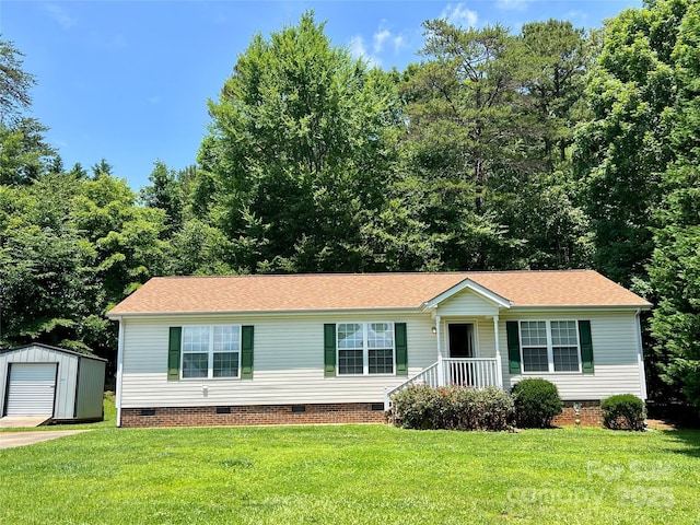 1031 Daniel Dr, Stanley, NC 28164 - view of front of house featuring crawl space, an outdoor structure, a front lawn, and roof with shingles