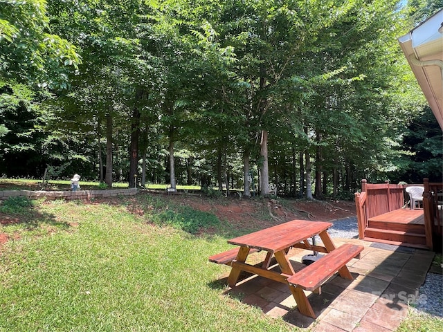 1031 Daniel Dr, Stanley, NC 28164 - view of green lawn featuring outdoor dining space, a wooden deck, and a patio area