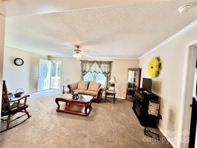 1031 Daniel Dr, Stanley, NC 28164 - living room featuring ornamental molding, a textured ceiling, carpet flooring, a ceiling fan, and baseboards