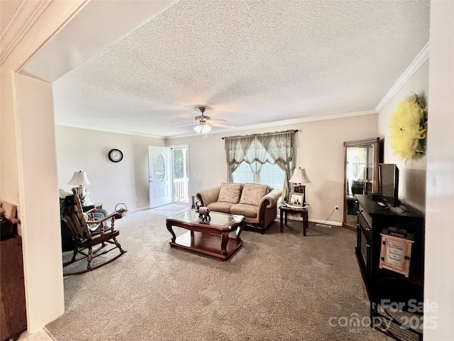 1031 Daniel Dr, Stanley, NC 28164 - carpeted living area featuring a textured ceiling, crown molding, ceiling fan, and baseboards
