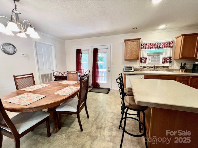 1031 Daniel Dr, Stanley, NC 28164 - dining area featuring ornamental molding, a chandelier, and a textured ceiling