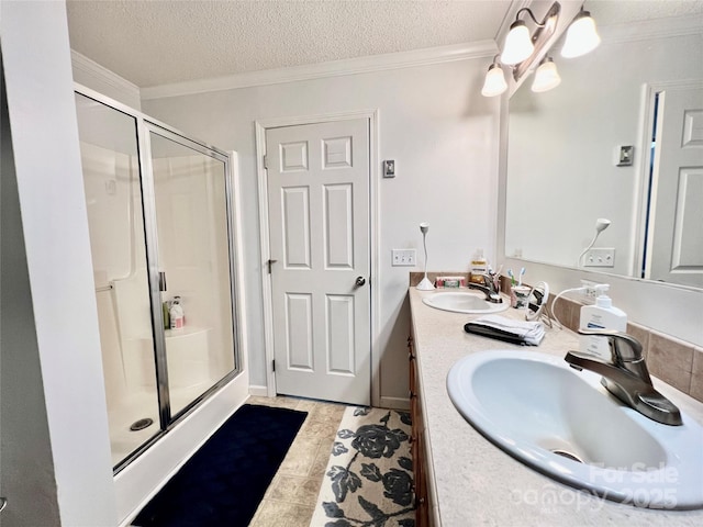 1031 Daniel Dr, Stanley, NC 28164 - bathroom featuring a stall shower, double vanity, crown molding, and a textured ceiling