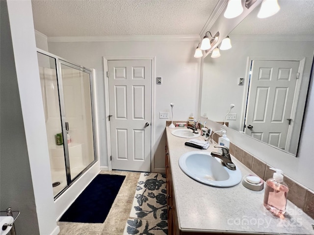 1031 Daniel Dr, Stanley, NC 28164 - full bathroom featuring a textured ceiling, a shower stall, double vanity, and ornamental molding