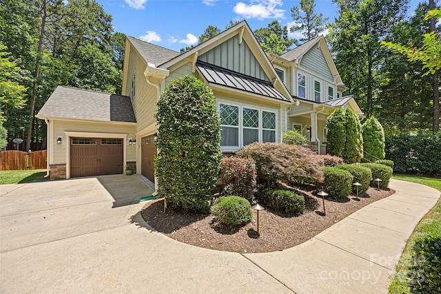 6422 Northern Red Oak Dr, Mint Hill, NC 28227 - view of front facade featuring a garage, a standing seam roof, board and batten siding, driveway, and roof with shingles