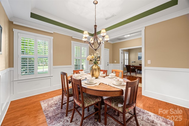 6422 Northern Red Oak Dr, Mint Hill, NC 28227 - dining room with a chandelier, wainscoting, healthy amount of natural light, crown molding, and a raised ceiling