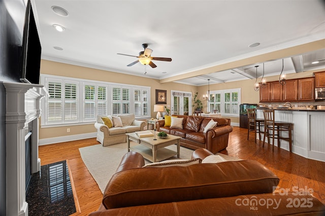 6422 Northern Red Oak Dr, Mint Hill, NC 28227 - living area featuring ceiling fan, a high end fireplace, beamed ceiling, wood finished floors, and crown molding