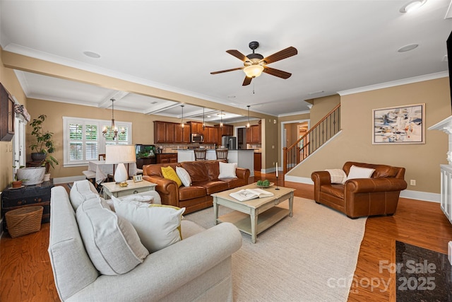6422 Northern Red Oak Dr, Mint Hill, NC 28227 - living room with ceiling fan, light wood-type flooring, stairs, a chandelier, and beam ceiling