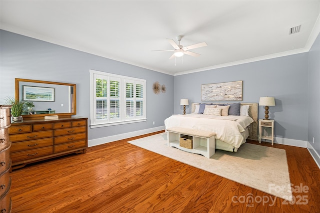 6422 Northern Red Oak Dr, Mint Hill, NC 28227 - bedroom with wood finished floors, ceiling fan, and crown molding