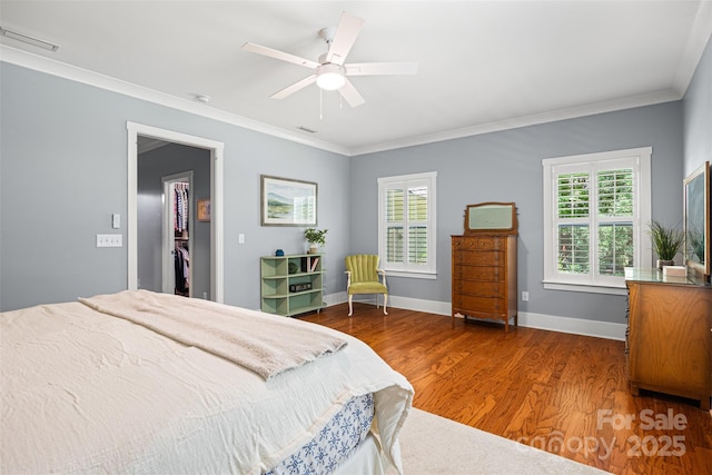 6422 Northern Red Oak Dr, Mint Hill, NC 28227 - bedroom with wood finished floors, multiple windows, crown molding, and a ceiling fan
