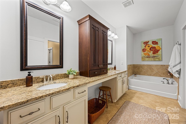 6422 Northern Red Oak Dr, Mint Hill, NC 28227 - bathroom with tile patterned floors, double vanity, and a garden tub