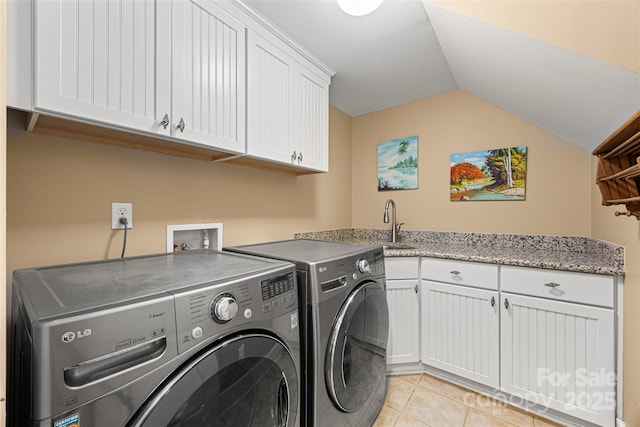6422 Northern Red Oak Dr, Mint Hill, NC 28227 - laundry room with washer and clothes dryer, cabinet space, and light tile patterned floors