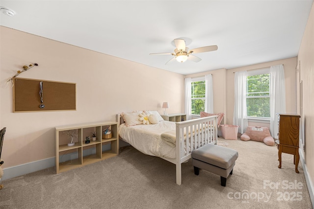 6422 Northern Red Oak Dr, Mint Hill, NC 28227 - carpeted bedroom with ceiling fan and baseboards
