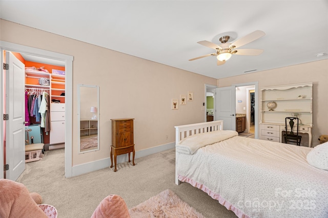 6422 Northern Red Oak Dr, Mint Hill, NC 28227 - bedroom featuring a walk in closet, a closet, light colored carpet, and a ceiling fan