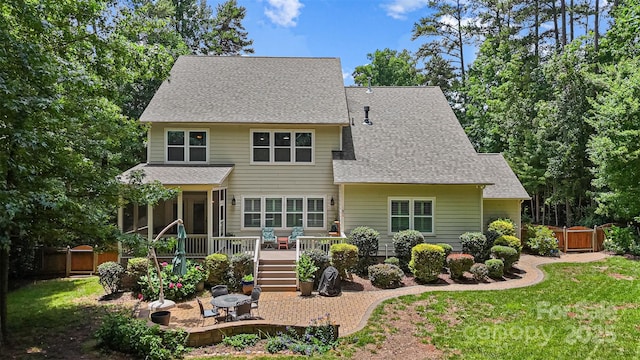 6422 Northern Red Oak Dr, Mint Hill, NC 28227 - back of property with a wooden deck, roof with shingles, and a sunroom